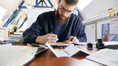 En train de dessiner Jean Cremers