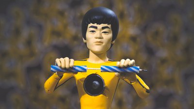 Petit Dragon Bruce Lee casse une bougie