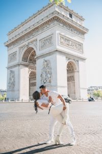 couple elopes in paris. Vows renewal in front of the Eiffel tower and Arc de Triomphe